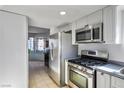 Kitchen with stainless steel appliances and view into dining area at 332 Oakford St, Las Vegas, NV 89110