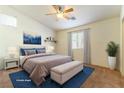 Virtually staged bedroom with large bed and ensuite bath at 3728 Discovery Creek Ave, North Las Vegas, NV 89031