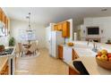 Virtually staged kitchen with breakfast nook and modern appliances at 3728 Discovery Creek Ave, North Las Vegas, NV 89031