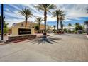 Black Hawk community entrance with palm trees and gated access at 3929 Pepper Thorn Ave # 101, North Las Vegas, NV 89081