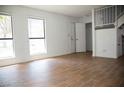 Spacious living room with tile floors and a view of the stairs at 3937 S Torrey Pines Dr, Las Vegas, NV 89103