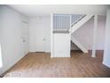 Living room featuring tile floors and staircase at 3937 S Torrey Pines Dr, Las Vegas, NV 89103