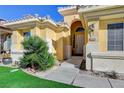 Front entry of a house with a walkway and landscaping at 4532 Laguna Vista St, Las Vegas, NV 89147