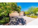 Landscaped front yard with paver driveway and mature trees at 5170 Agio Ave, Pahrump, NV 89061