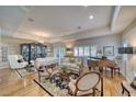 Formal living room with hardwood floors, piano, and neutral-colored walls at 5170 Agio Ave, Pahrump, NV 89061