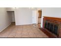 Living room with fireplace and tile floors at 5453 Requa Ave, Las Vegas, NV 89110