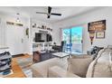 Living room with sectional sofa, TV, and built-in shelving at 5751 E Hacienda Ave # 232, Las Vegas, NV 89122