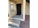 Condo entryway featuring a black door and steps at 601 Cabrillo Cir # 323, Henderson, NV 89015