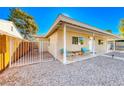 Inviting front porch with seating area and view of the nicely landscaped yard at 801 7Th St, Boulder City, NV 89005