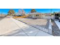 Well maintained front yard with gravel landscaping and walkway to the house at 801 7Th St, Boulder City, NV 89005