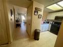 Kitchen features dark countertops, white cabinets and black appliances at 833 Aspen Peak Loop # 1014, Henderson, NV 89011