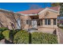 Home exterior showcasing a patio area with landscaping at 8608 Millsboro Dr, Las Vegas, NV 89134