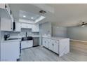 Newly remodeled kitchen with white shaker cabinets and quartz countertops at 936 Boulder Mesa Dr # 201, Las Vegas, NV 89128