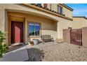 Inviting front porch with seating area and landscaping at 9916 Fallowdeer Ct, Las Vegas, NV 89149