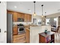 Modern kitchen with stainless steel appliances and island at 9916 Fallowdeer Ct, Las Vegas, NV 89149