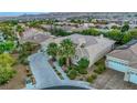 Single-Gathering home with a tile roof and solar panels in a residential neighborhood at 10275 Tresor Ct, Las Vegas, NV 89135