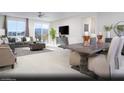 Open dining area with wood table and mountain views at 10937 Cilantro Ave # Lot 102, Las Vegas, NV 89166