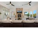 Spacious living room featuring a fireplace and large windows at 1635 Liege Dr, Henderson, NV 89012