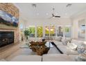 Bright living room featuring a fireplace, large windows and comfortable seating at 1635 Liege Dr, Henderson, NV 89012