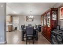 Formal dining area with a large table and a wooden cabinet at 1920 Wendell Ave, Las Vegas, NV 89101