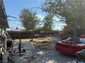 Backyard with playset, storage, and cars at 2127 Crawford St, North Las Vegas, NV 89030