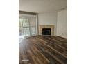 Living room with fireplace and wood-look floors at 2200 S Fort Apache Rd # 2050, Las Vegas, NV 89117