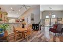 Bright dining room with a wood table and hardwood floors at 2715 Coral Cliffs Ct, North Las Vegas, NV 89031