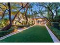 Landscaped backyard with artificial turf and gazebo at 3074 Monte Rosa Ave, Las Vegas, NV 89120