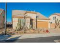 Single-story home with desert landscaping and two-car garage at 3096 Beaux Art Ave, Henderson, NV 89044