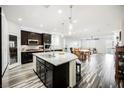 Spacious kitchen with island, stainless steel appliances, and hardwood floors at 3096 Beaux Art Ave, Henderson, NV 89044