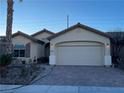 One-story home with attached garage and landscaped front yard at 3363 Blue Ribbon Downs St, Las Vegas, NV 89122