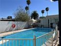 Sparkling blue pool with safety fence at 3712 San Joaquin Ave, Las Vegas, NV 89102