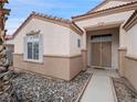 House entrance with double doors and a walkway at 414 Maritocca Ave, North Las Vegas, NV 89031