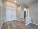 Inviting foyer with double doors, clerestory window and luxury vinyl plank flooring at 414 Maritocca Ave, North Las Vegas, NV 89031