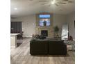 Open living area showcasing a large stone fireplace and hardwood floors at 414 Maritocca Ave, North Las Vegas, NV 89031