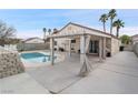 Backyard with refreshing pool, patio, and pergola at 414 Maritocca Ave, North Las Vegas, NV 89031