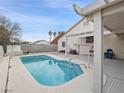 Relaxing backyard oasis with a sparkling pool and covered patio at 414 Maritocca Ave, North Las Vegas, NV 89031