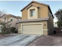 Tan two-story house with attached garage and landscaping at 5066 El Castano Ave, Las Vegas, NV 89108