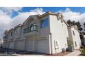 View of townhome building with attached garages at 6201 E Lake Mead Blvd # 218, Las Vegas, NV 89156