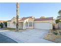 Front view of a single-story house with a large palm tree at 6617 Old Newbury Ave, Las Vegas, NV 89108