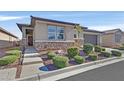 One-story home with stone accents and well-manicured landscaping at 6914 Willowcroft St, Las Vegas, NV 89149