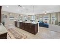 Open concept kitchen with island, granite countertops, and stainless steel appliances at 6914 Willowcroft St, Las Vegas, NV 89149