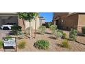 Landscaped front yard with gravel and plants at 7050 Fossil Rim St, Las Vegas, NV 89084