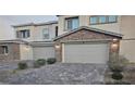 Two-car garage with paver driveway at 7050 Fossil Rim St, Las Vegas, NV 89084