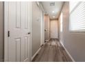 Interior hallway with gray walls and wood-look flooring at 7122 Rocket Launch St, North Las Vegas, NV 89084