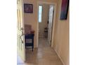 Clean entryway with a half bathroom and tile flooring at 8157 Amy Springs St, Las Vegas, NV 89113