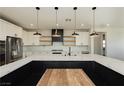 Gorgeous kitchen featuring a large island, stainless steel appliances, and modern lighting at 8224 Skye Territory St, Las Vegas, NV 89166