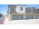 Attached two-car garage with gray doors at 9131 Hitmaker St, Las Vegas, NV 89113