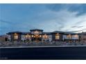 Modern house with a neutral color scheme and stone facade at 9525 Ponderay Ct, Las Vegas, NV 89149