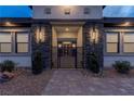 Inviting front entrance with stone pillars and a modern gate at 9525 Ponderay Ct, Las Vegas, NV 89149